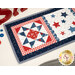 A close up on the patchwork on the end of the small table topper. 