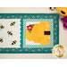 A top down shot of the patchwork, showing fabric and stitching details.