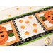 A close up on the center of the small table topper, showing off the laser cut candy corn and scallop borders. 