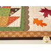 A close up shot of the scallop border between the patchwork leaf and laser cut leaves. 