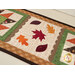 A close up on the center of the small table topper, showing off the laser cut leaves and scallop borders. 