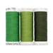 Three green spools of thread next to each other, isolated on a white background.