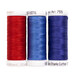 Three colorful spools of thread sit together, isolated on a white background.