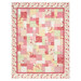 The completed Easy as ABC and 123 quilt kit colored in soft red, pink and white fabric from the  Yours Truly collection by P&B Textiles, isolated on a white background. 