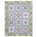 The completed Bouquet of Hydrangeas Quilt, colored in powder blue, purple, green, and white fabrics from the Hydrangeas in the Garden collection from Riley Blake Designs, isolated on a white background.