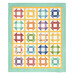 The completed Churn Dash Layer Cake Quilt colored in vibrant prints from the Aunt Grace Goes Scrappy collection by Marcus Fabrics, isolated on a white background.
