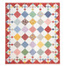 The completed Diamond Patch Crib Quilt Kit colored in vintage red, yellow, blue and green, fabrics from the 30's Playtime collection by Moda Fabrics, isolated on a white background. 