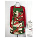 An example of the Simply Charming Apron, completed in Christmas-themed fabrics from the Poinsettias at Christmas collection by Jennifer Bosworth for Riley Blake Designs, paired with a red shirt.