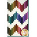 A closeup on the patchwork on the quilt, demonstrating fabric color and print details.
