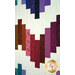 A closeup on the patchwork on the quilt, demonstrating fabric color and print details.