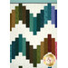 A closeup on two patchwork rows of the quilt, demonstrating fabric color and print details.