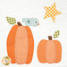 A close up shot of a quilt block featuring two pumpkins with a blue bird perched on top and a twinkling star in the sky.