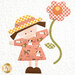 A close up shot of a quilt block featuring a little girl in a sun hat holding a cut flower. 