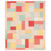 The completed Turning Twenty quilt, colored in the Lyda Rose collection by Moda, isolated on a white background. 