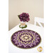 The completed Folded Star Table Topper, colored in purple, tan, and green fabrics from the Collection for a Cause - Essence series from Moda Fabrics, staged on a white table with coordinating flowers.