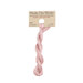 A skein of dusty rose embroidery floss, twisted and bundled, with a tan label featuring the brand name and color information.