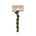 A skein of green embroidery floss, twisted and bundled, with a tan label featuring the brand name and color information.