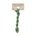 A skein of mint green embroidery floss, twisted and bundled, with a tan label featuring the brand name and color information.