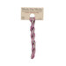 A skein of variegated light green and magenta embroidery floss, twisted and bundled, with a tan label featuring the brand name and color information.