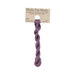 A skein of dusty lilac embroidery floss, twisted and bundled, with a tan label featuring the brand name and color information.