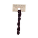 A skein of dark cherry embroidery floss, twisted and bundled, with a tan label featuring the brand name and color information.