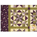 A close up on the patchwork of the quilt, demonstrating details on the fabrics, piecing, and top quilting.