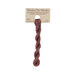 A skein of muted cranberry red embroidery floss, twisted and bundled, with a tan label featuring the brand name and color information.