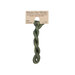 A skein of variegated forest green embroidery floss, twisted and bundled, with a tan label featuring the brand name and color information.