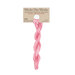 A skein of variegated pink embroidery floss, twisted and bundled, with a tan label featuring the brand name and color information.