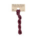 A skein of muted burgundy embroidery floss, twisted and bundled, with a tan label featuring the brand name and color information.