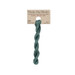 A skein of Turquoise embroidery floss, twisted and bundled, with a tan label featuring the brand name and color information.