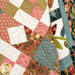 The Riviera Rose Quilt draped, demonstrating movement. 