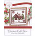 Cover of a cross-stitch pattern featuring a quilt barn in a winter scene, with decorative elements and text.