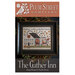 Front of pattern showing the completed cross stitch design framed with brambles in the background. 