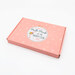 A shot of the Needle Minder of the Month box displayed on a white table.