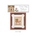 The front of the "Santa's House" cross stitch pattern featuring a house, Santa Claus, and a Christmas tree.