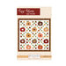 Front cover of the Cozy Autumn quilt pattern featuring patchwork pumpkins, falling leaves, and hearts.