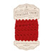 red ric-rac trim on ins cardboard packaging, isolated on a white background.
