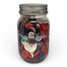 A glass jar filled with assorted buttons in red, white, and blue, labeled Buttons Galore.