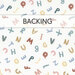 A white fabric with tossed letters of the alphabet in rainbow colors and fun prints. A transparent banner at the top reads "Backing."