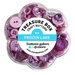 A clear container shaped like a flower holds various purple craft buttons labeled Sapphire Quartz.