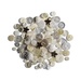 A scattered collection of various ivory buttons in different sizes and styles.
