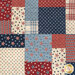 A head-on close up of the patchwork featuring red, white, and blue patterns, including stars and stripes.