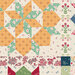 Cream fabric with a patchwork design featuring floral and geometric prints from the collection.