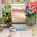 A stack of the fabrics included in the Backroad Blooms collection, with a garden and a window and a truck and a mason jar and flowers and thread.