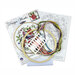 The contents of the Butterflies cross stitch picture kit, including fabric, needle, hoop, floss, and the pattern.