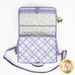 The bathroom bag partially unfolded, the mesh pouch and charm can be seen. 