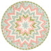 A round table topper with a bursting star design in light pink, mint, teal, and cream fabrics isolated on a white background.