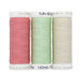 Three spools of sewing thread in pink, cream, and mint, isolated on a white background.