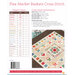 Image of a cross stitch pattern titled “Flea Market Baskets,” featuring colorful geometric designs and color chart.